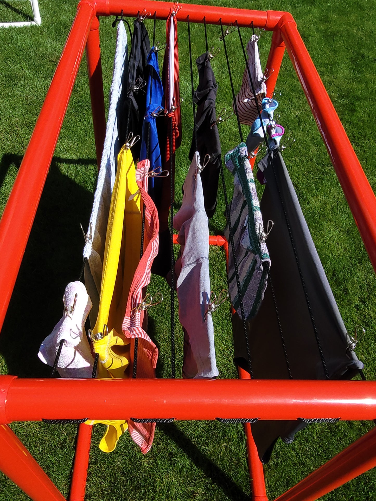 Red pvc clothes dryer outside