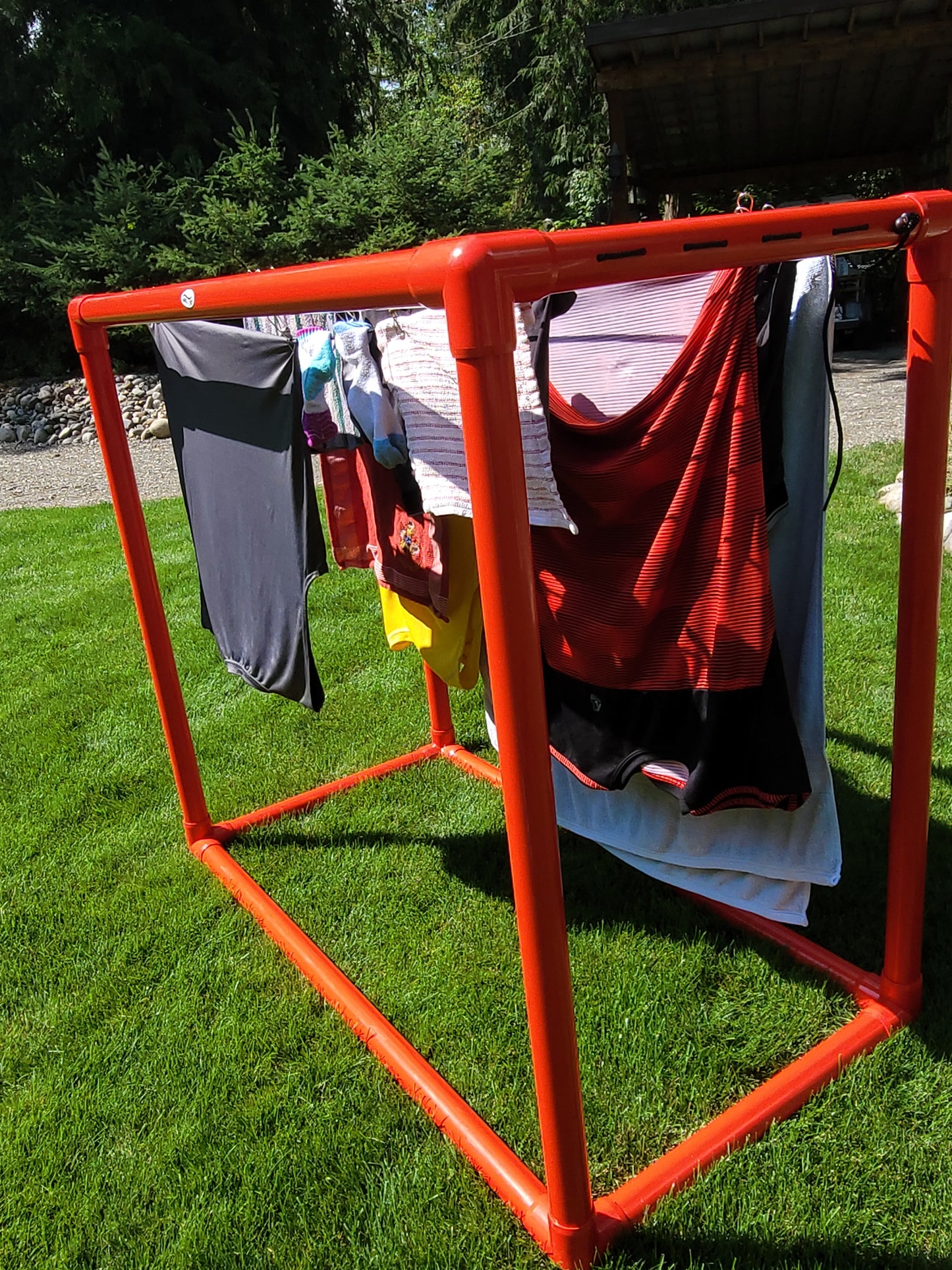 red PVC Hangedry on lawn